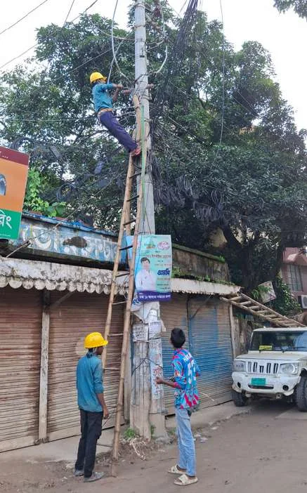 Electrical technicians working on an overhead line