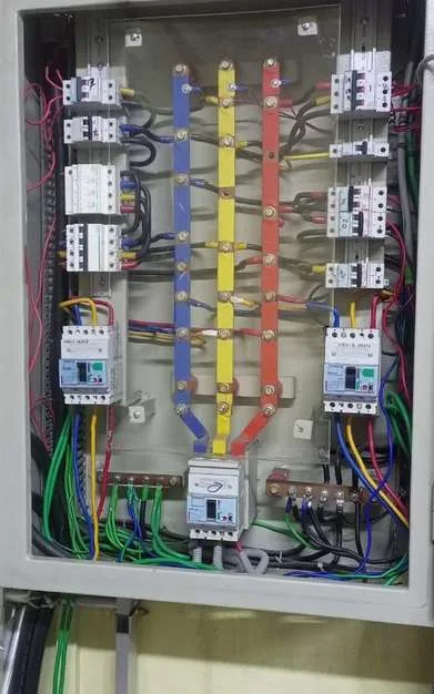 Electrical distribution panel with breakers and busbars