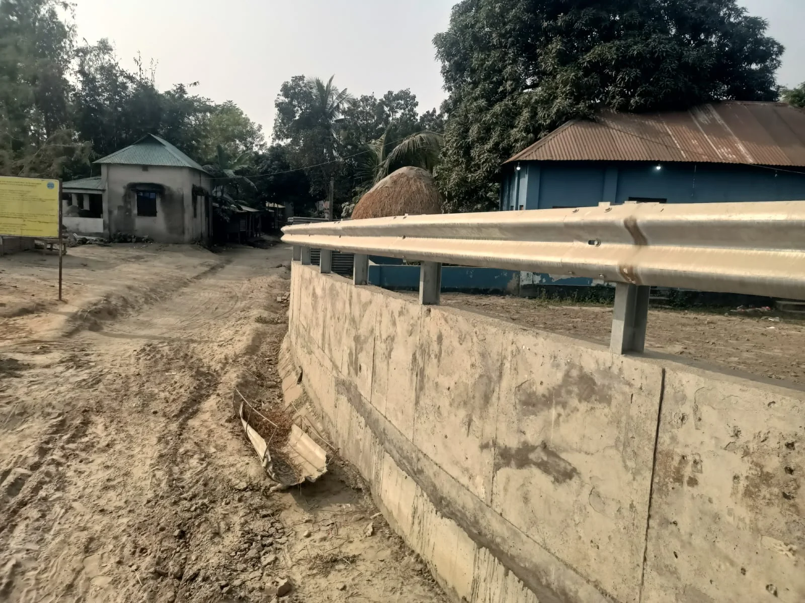 Guardrail above a roadside retaining wall — Hamida Traders Guardrail