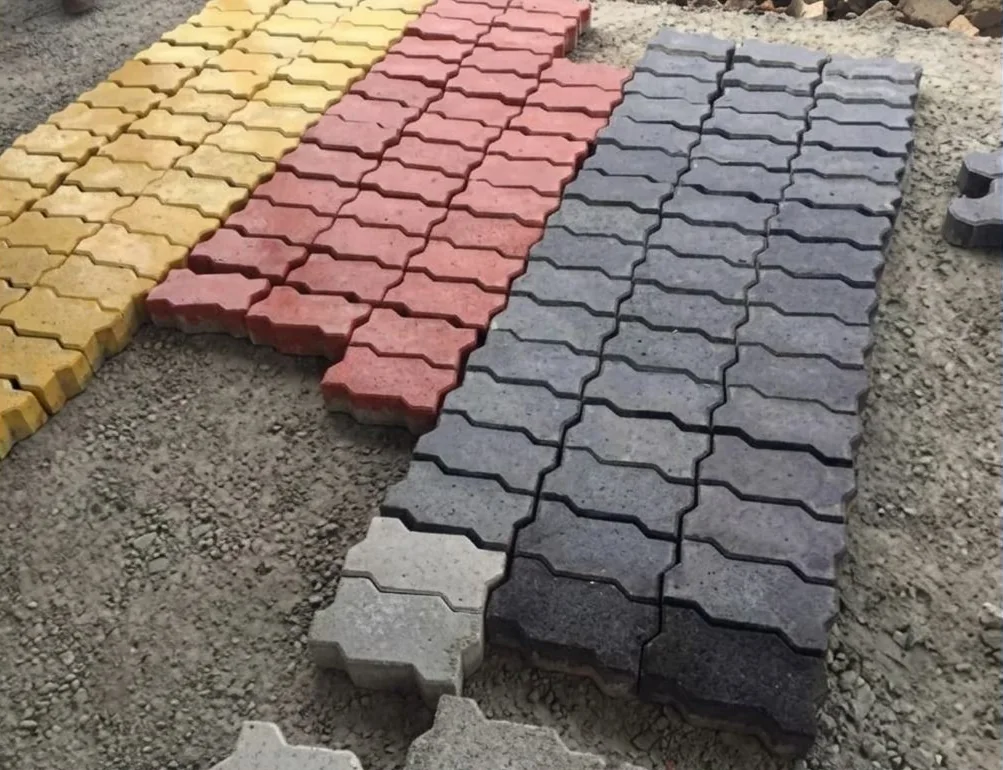 Coloured interlocking paving blocks laid in patterns