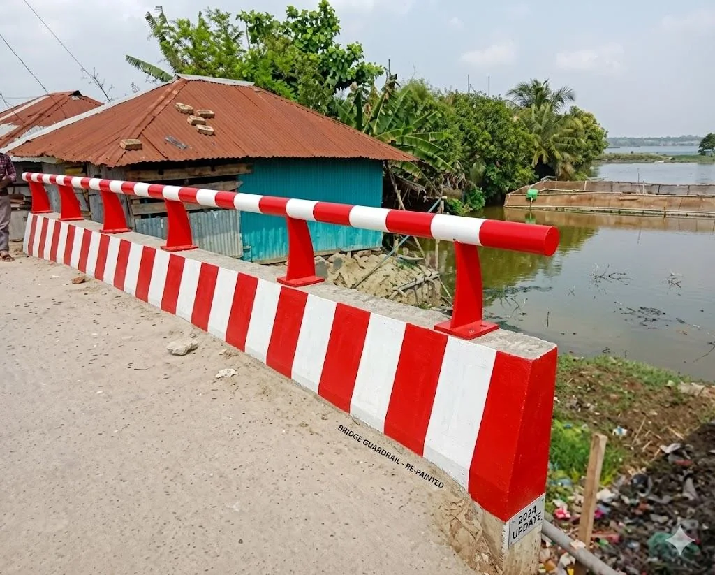 Red and white painted roadside barrier