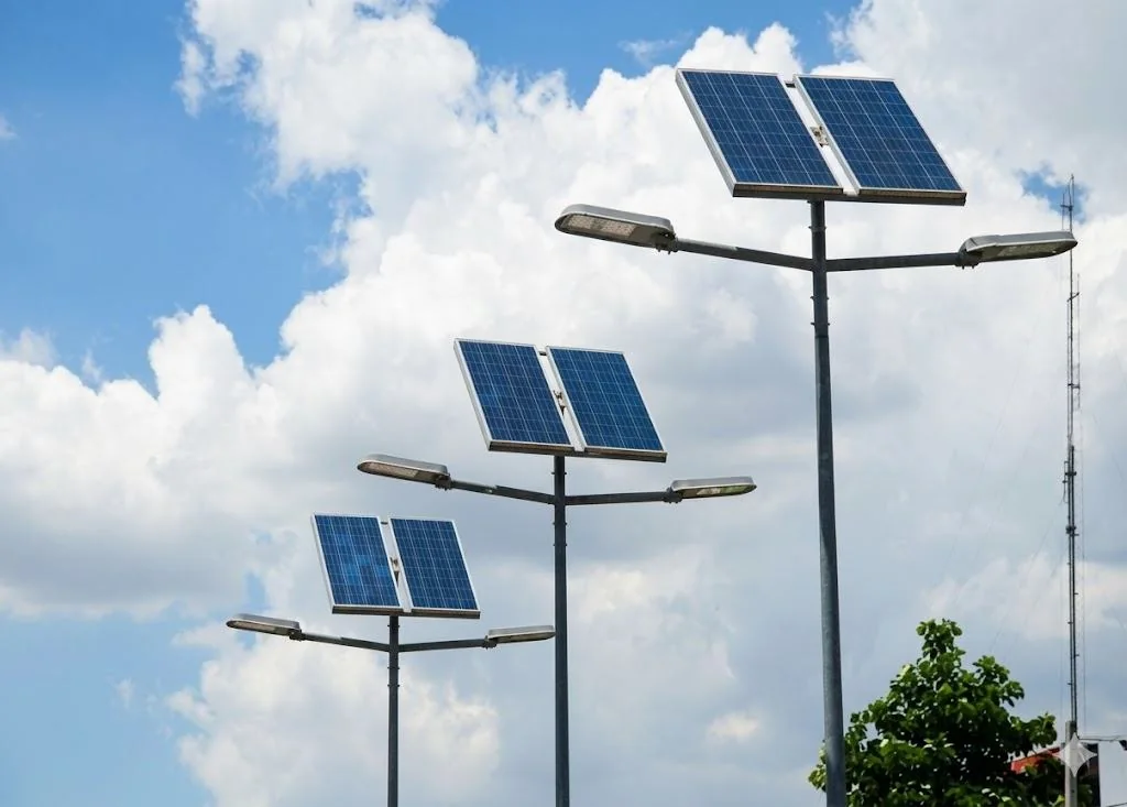 Solar street lights against a cloudy sky
