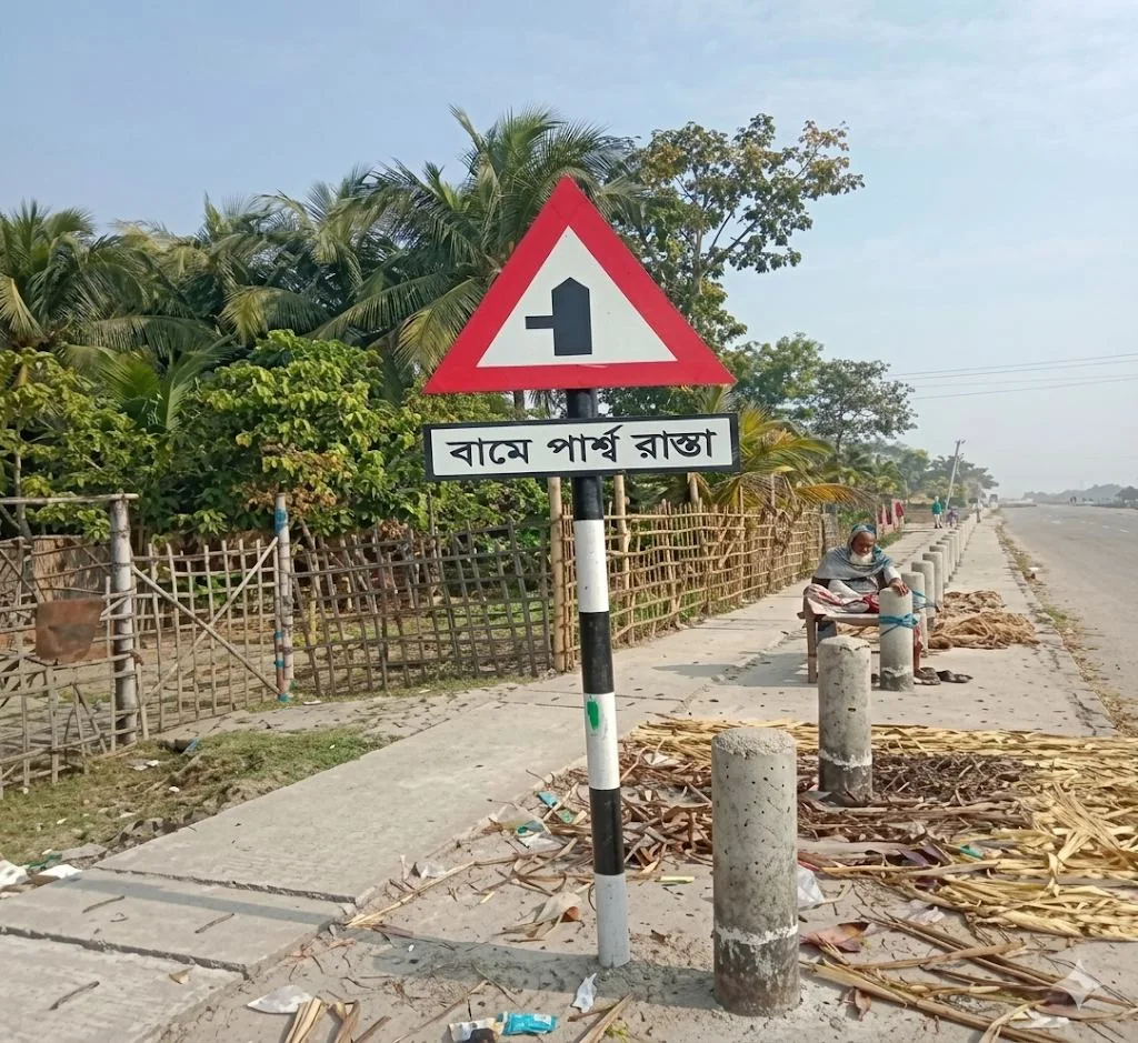Triangular roadside warning sign