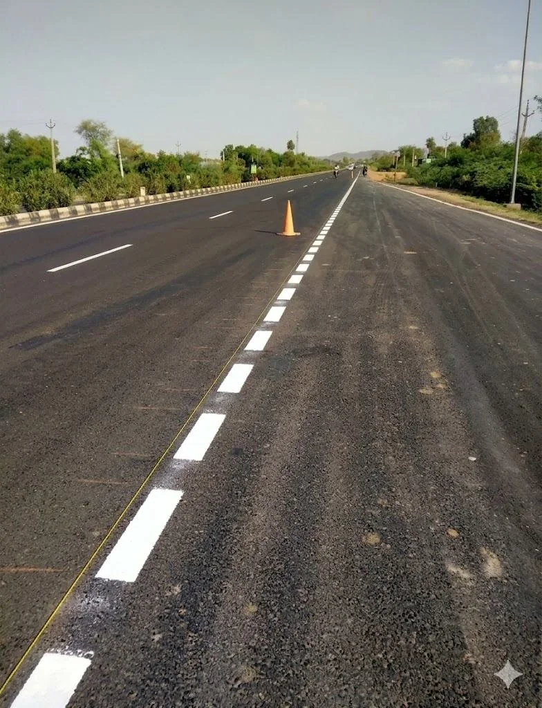 White lane markings on a paved road